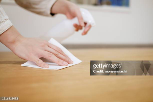 wiping on the desk to prevent infectious virus - rubbing stock pictures, royalty-free photos & images