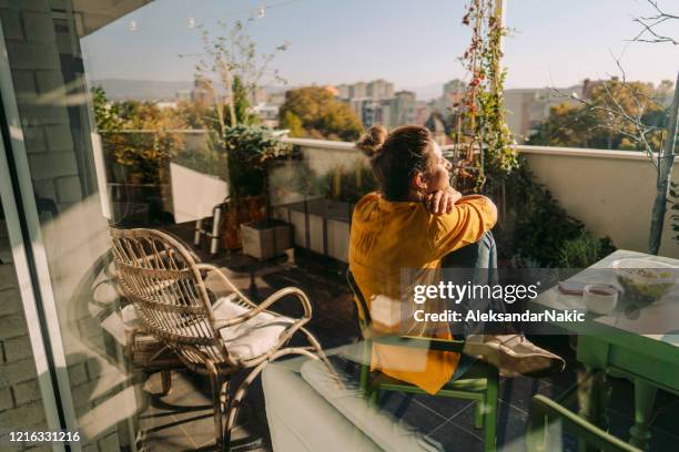 enjoying spring on my balcony - modern balcony stock pictures, royalty-free photos & images