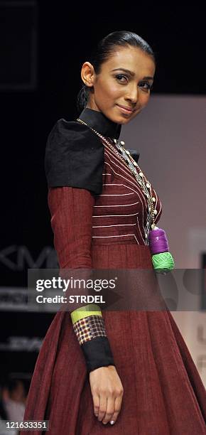 An Indian model displays a creation by designer Sabah Khan on the fifth day of Lakme Fashion Week Winter/Festival 2011 in Mumbai on August 21, 2011....