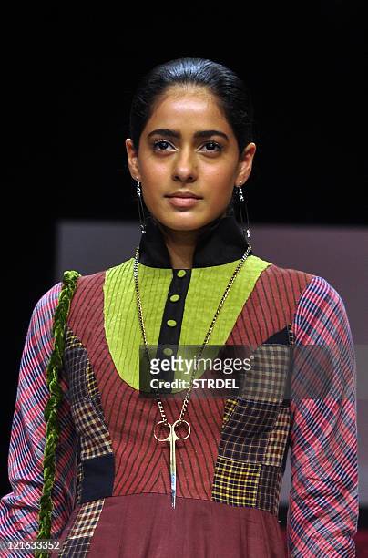 An Indian model displays a creation by designer Sabah Khan on the fifth day of Lakme Fashion Week Winter/Festival 2011 in Mumbai on August 21, 2011....