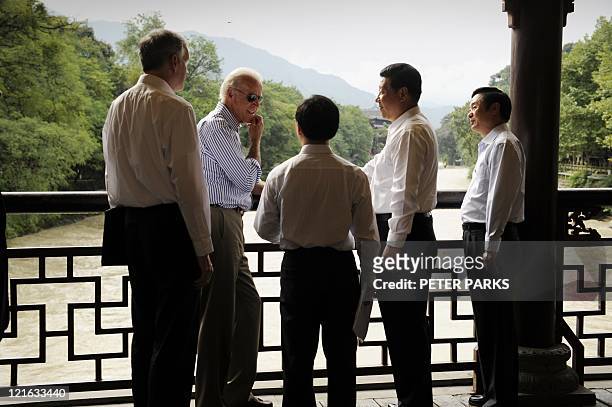 Vice President Joe Biden and Chinese Vice President Xi Jinping accompanied by their translators talk on the Dujiangyan Irrigation System in...