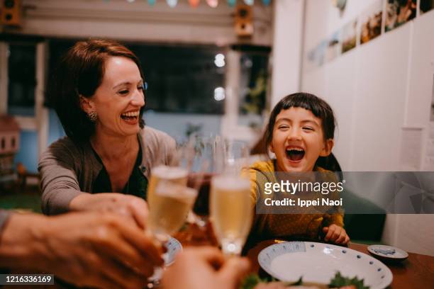 family toasting at dinner - 飲み会��　日本 ストックフォトと画像
