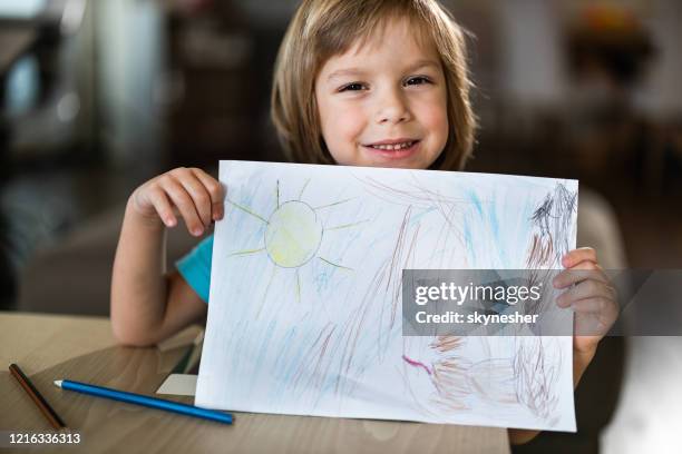 look at my drawing! - kid holding crayons stock pictures, royalty-free photos & images