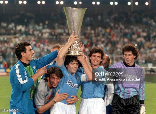 Raffaele Di Fusco,Massimo Crippa, Diego Armando Maradona, Francesco Romano and Giuliano Giuliani of SSC Napoli celebrate his victory with the trophy...