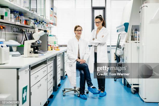 portrait of two scientists in the laboratory - scientist full length stock pictures, royalty-free photos & images