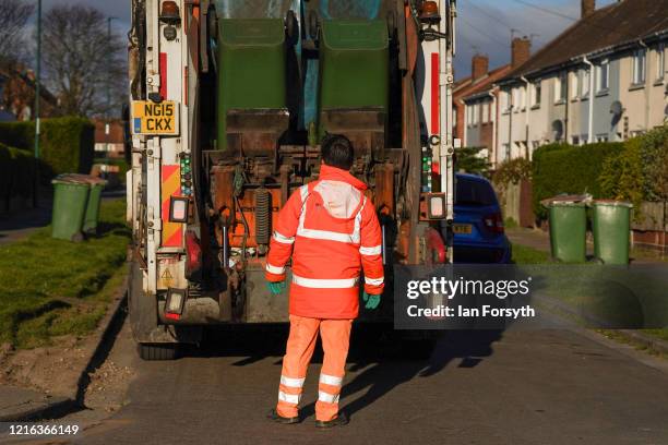 Refuse collector from Redcar and Cleveland Council works to empty bins in the streets of Saltburn as the UK adjusts to life under the Coronavirus...