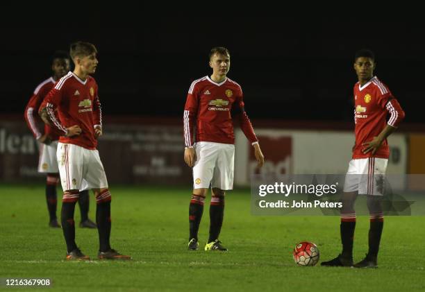 Callum Gribbin, Charlie Scott and Marcus Rashford of Manchester United U18s react to conceding the opening goal during the FA Youth Cup fourth round...