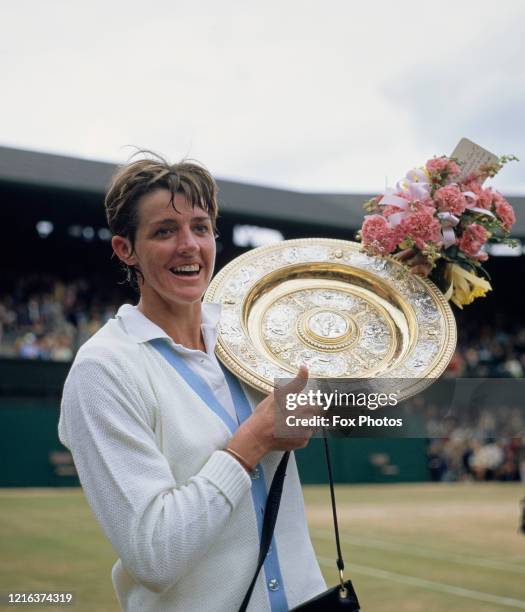 Margaret Court of Australia holds the Venus Rosewater Dish after defeating Billie Jean King of the United States, 14-12, 11-9 in the Women's Singles...