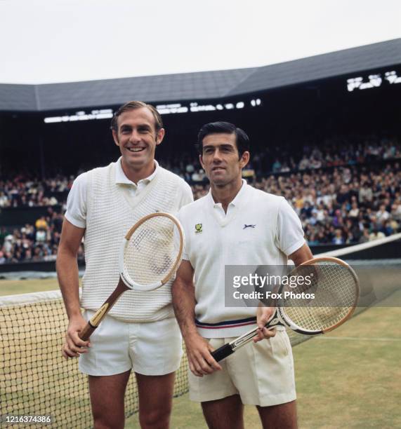 John Newcombe of Australia and compatriot Ken Rosewall pose for photographs before their Men's Singles Final match at the Wimbledon Lawn Tennis...