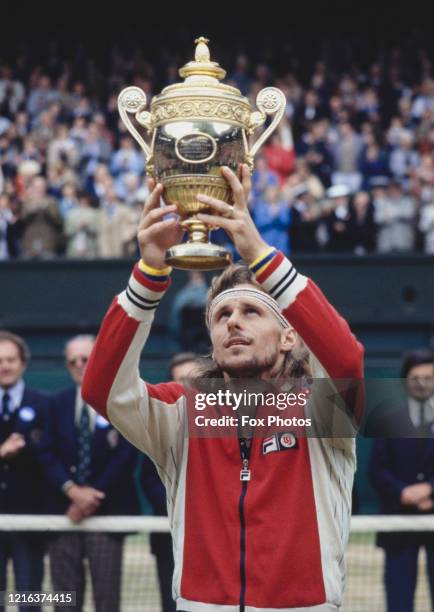 Bjorn Borg of the Sweden holds the Gentlemen's Singles Championship Trophy aloft after defeating Jimmy Connors of the United States during the Men's...