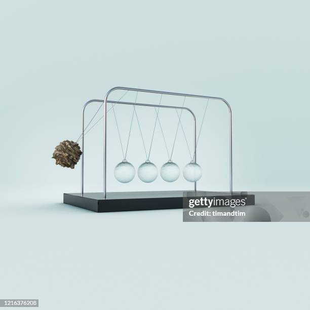 newton's cradle made of glass and stone - newtons cradle stockfoto's en -beelden