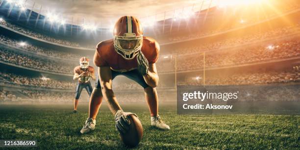 american football player in action - college quarterback stock pictures, royalty-free photos & images