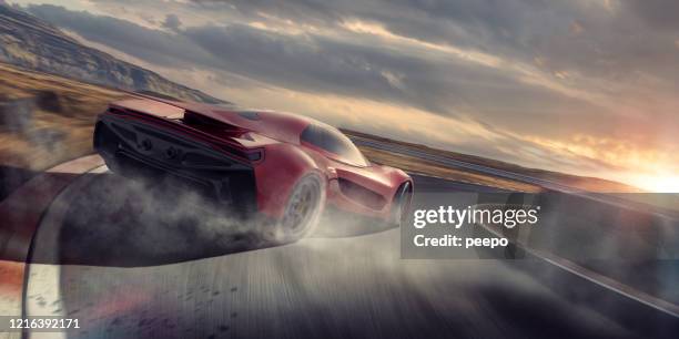 generic red sports car drifting around racetrack corner at speed - muscle car imagens e fotografias de stock