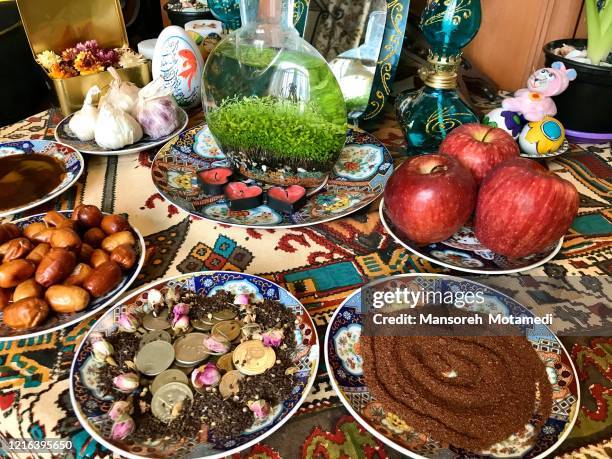 haft-sin symbolism - nowruz stock-fotos und bilder