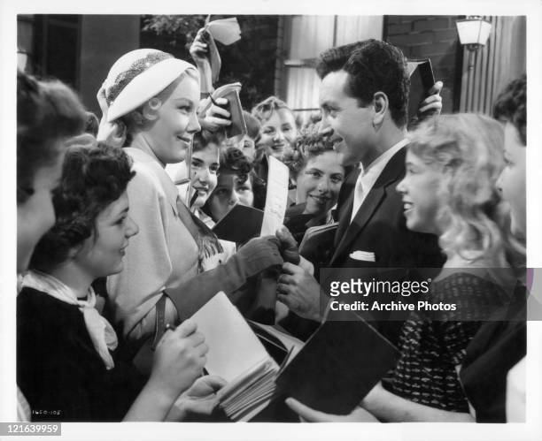 Lucille Knoch wants Vic Damone autograph in a scene from the film 'Athena', 1954.