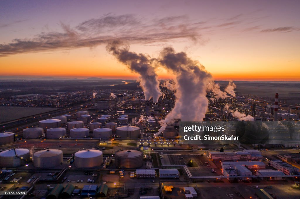 Aerial view of oil refinery at sunset.