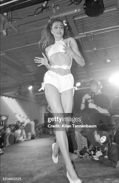 View of an unidentified model on the catwalk during a show of Betsey Johnson's fashions, New York, New York, November 5, 1980.