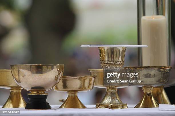 Chalice and communion cups stand on an altar during a Catholic outdoor mass to mark the Ascension of Mary to Heaven at Etzelsbach Chapel on August...