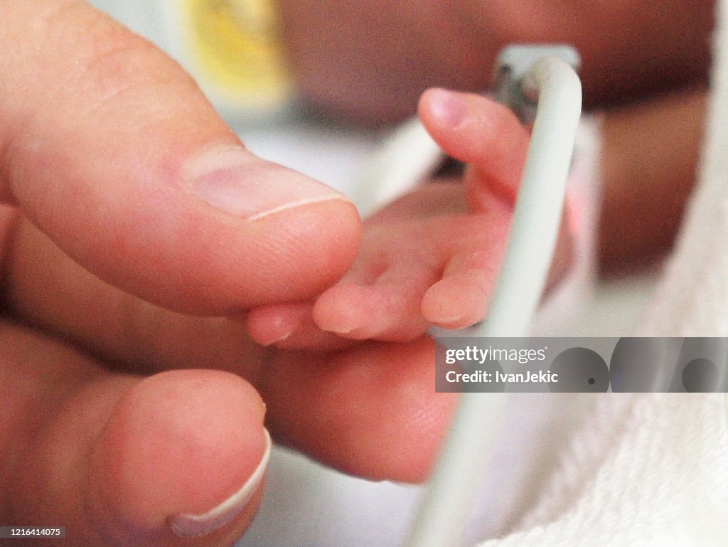 Mother and preterm baby first touch