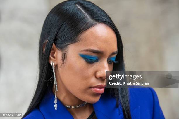 Stylist and Digital influencer Aleali May wears all Mugler and blue eyeshadow on February 26, 2020 in Paris, France.
