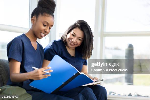 young adult female nursing students study together - community college stock pictures, royalty-free photos & images