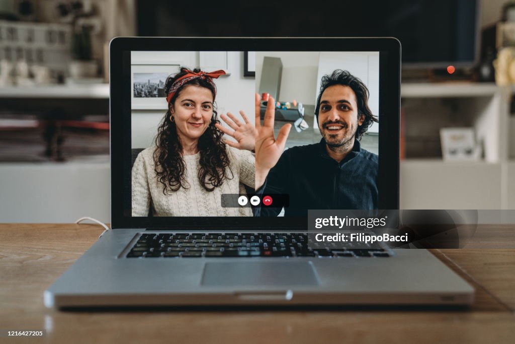 Laptop with a videoconference call on the screen