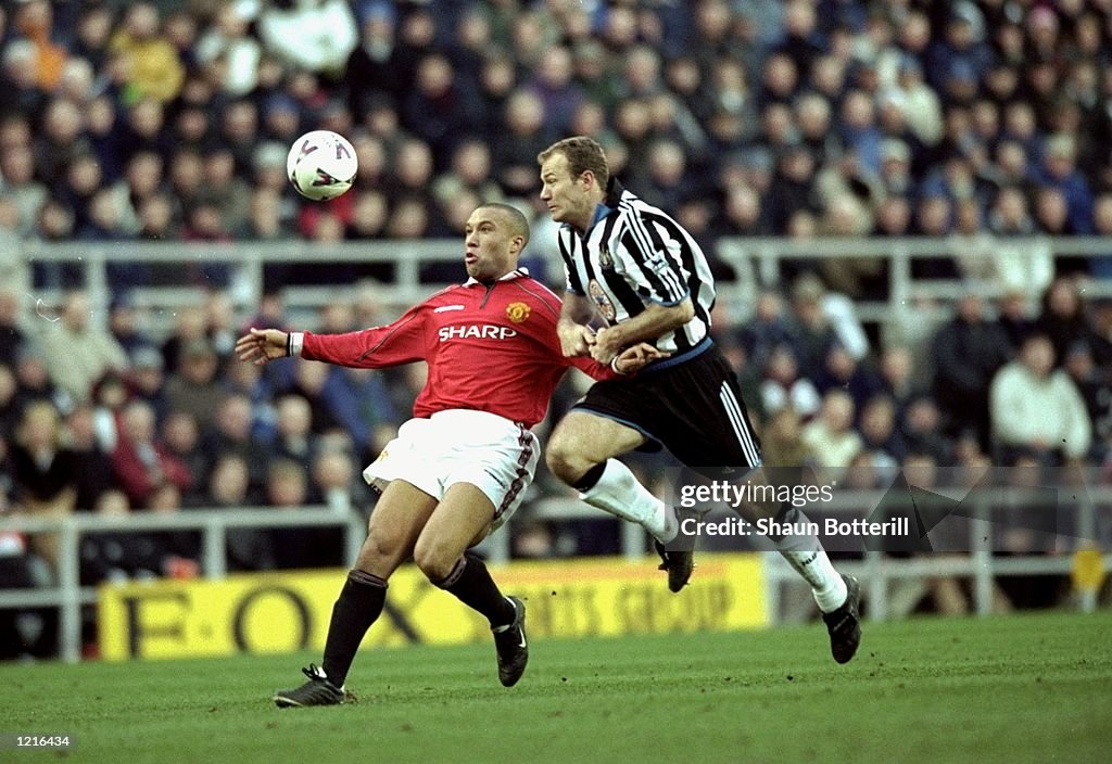 Mikael Silvestre and Alan Shearer