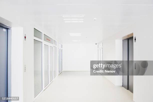 empty modern hospital corridor - hospital hallway no people stock pictures, royalty-free photos & images