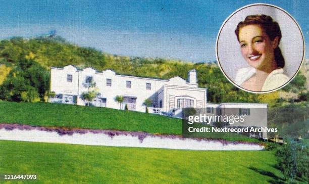 Vintage souvenir postcard published in 1940 from series depicting movie star homes of Hollywood, here with portrait of actress Dorothy Lamour and her...