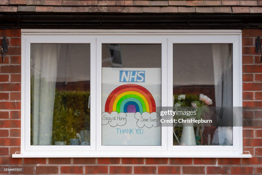 Rainbow drawings in window of house during Covid19 in UK.