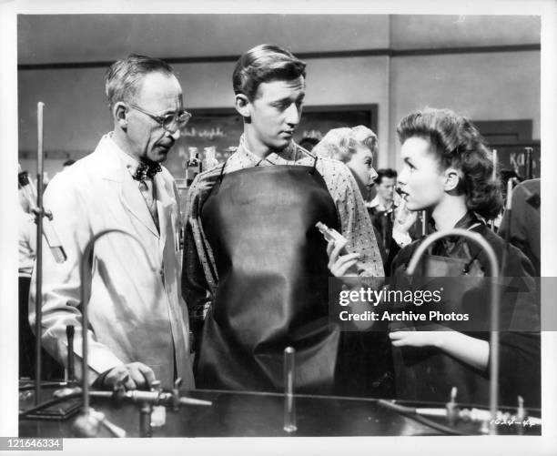 Bobby Van And Debbie Reynolds in chemistry lab in a scene from the film 'Affairs Of Dobie Gillis', 1953.