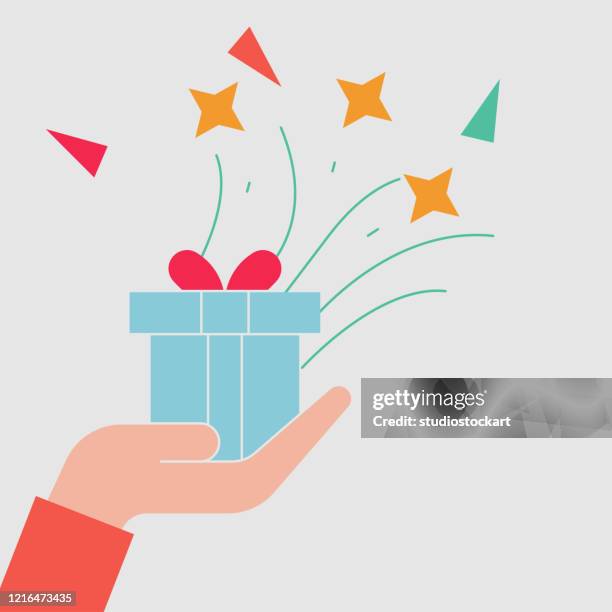 hand holding gift box - receiving present stock illustrations