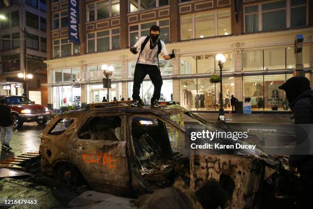 Protesters riot in the streets following a peaceful rally expressing outrage over the death of George Floyd on May 30, 2020 in Seattle, Washington....