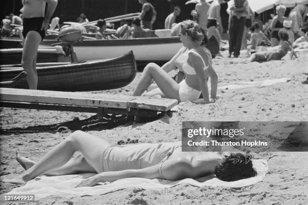 Women sunbathing on Paraggi Beach, near the tourist resort of Portofino, Italy, August 1952. Original Publication : Picture Post - 6023 - unpub.