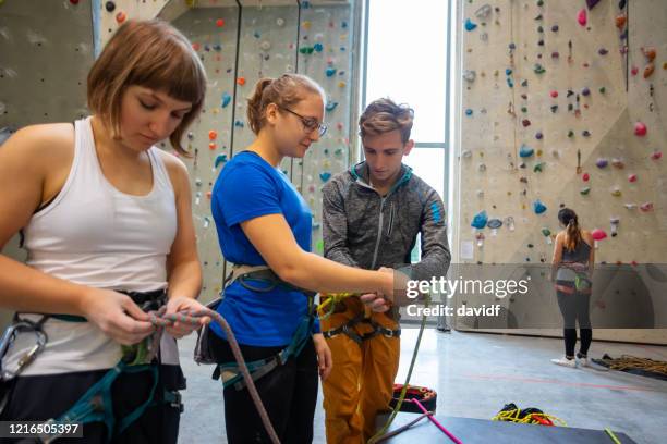 deaf and blind disabled woman at an indoor climbing gym - blind person stock pictures, royalty-free photos & images