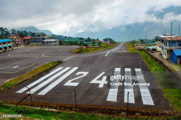 an empty airport runway of tenzing–hillary airport (known as lukla airport) in lukla, nepal. - lukla stock pictures, royalty-free photos & images