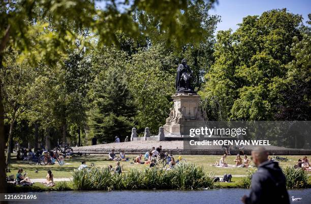 People enjoy the beautiful weather in the Vondelpark in Amsterdam, the Netherlands on May 31 2020, as the country eases lockdown measures taken to...