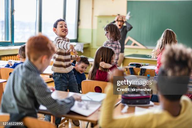 chaos in the classroom of elementary school! - chaos theory stock pictures, royalty-free photos & images