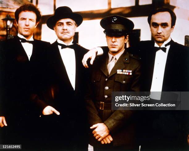 James Caan, US actor, Marlon Brando , US actor, Al Pacino, US actor, and John Cazale , US actor, all in black suits, shite shirts and black bow ties...