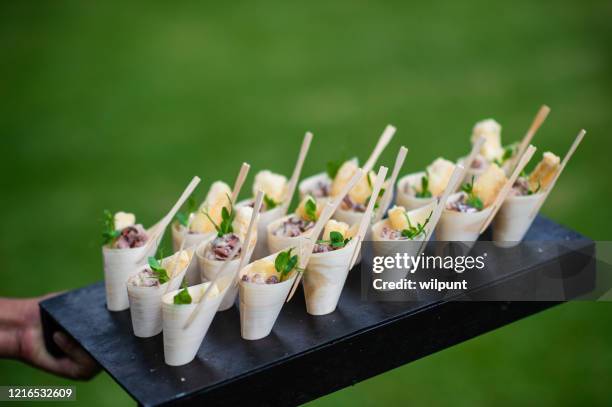 fried calamari scampi bamboo cone appetisers canapés served - canape stock pictures, royalty-free photos & images