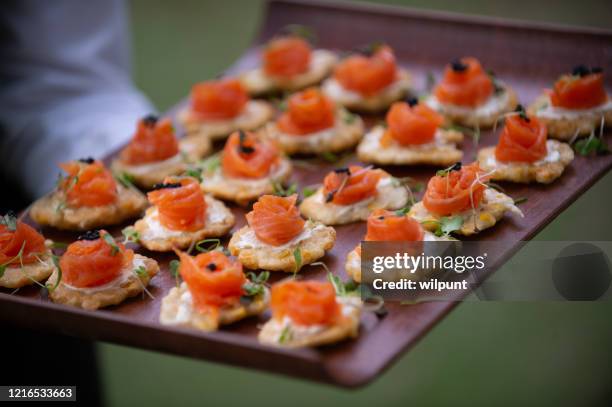 salmon appetisers canapes ready to be served closer - food and drink industry stock pictures, royalty-free photos & images