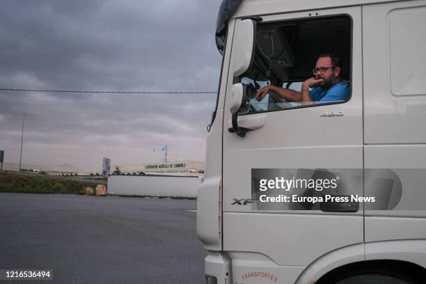 The photographer, Fabian A. Pons, take a picture to the truck driver, called Francisco, parked in the service area of Cambrils, adjacent to the A7...
