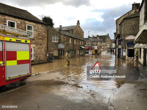 flooded streets of masham following the heavy rain from storm ciara - flood uk stock pictures, royalty-free photos & images