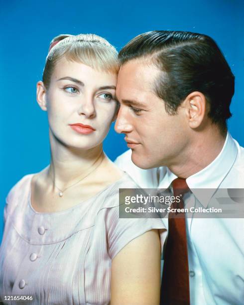 Joanne Woodward, US actress, and Paul Newman , US actor, in a studio portrait, against a blue background, issued as publcity for the film, 'The Long...