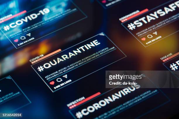 #quarantine hashtag for social networks close-up on digital display - coronavirus infographic stock pictures, royalty-free photos & images