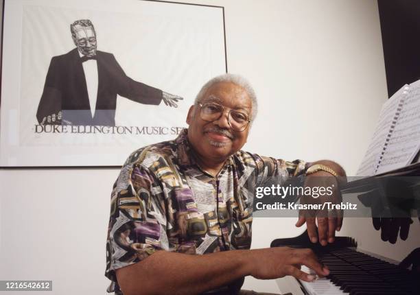 American jazz pianist Ellis Marsalis in New York City, 1995. Behind him is a poster of Duke Ellington.