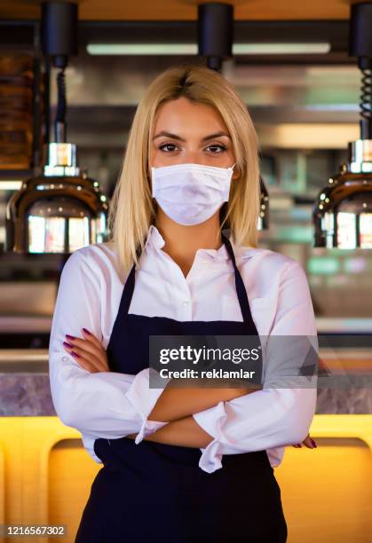waitress at a coffee shop, coronavirus concept. - restaurant server without mask stock pictures, royalty-free photos & images