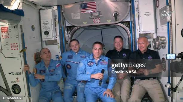 In this screen grab from NASA's feed, NASA astronauts Doug Hurley and Bob Behnken join NASA astronaut Chris Cassidy and Russian cosmonauts, Anatoly...