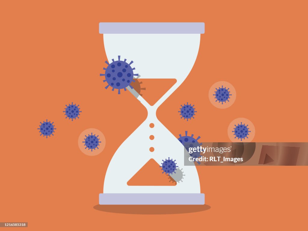 Hourglass umgeben von Coronavirus-Zellen läuft die Zeit