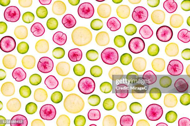 colorful radish slices back lit pattern - purple radish stock pictures, royalty-free photos & images